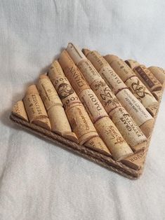 a bunch of wine corks sitting on top of a bed