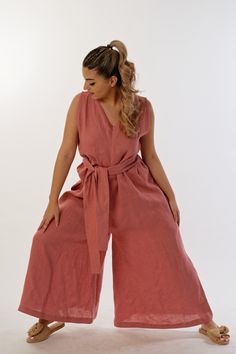 Sleek and modern, the Palazzo linen jumpsuit is an impressive choice for the season! This super trendy jumpsuit combines comfort and elegance in one. Its plunging neckline adds to its sophistication, with a front zip providing ease of undressing. Sleeveless and with a loose fit, this jumpsuit offers multiple sizes to suit different figures. It perfectly conceals and highlights your natural beauty. Floor-length and wide leg, it adds grace and grace to every step. The jumpsuit also features hidden side pockets that add practicality and functionality to the design. Made of 100% linen, it is breathable and comfortable to wear, especially on warm summer days. If you wish, you can wear it with the attached belt, which gives it the style of a long dress and allows you to create a variety of looks Linen V-neck Jumpsuits And Rompers For Spring, Spring Linen Jumpsuit With V-neck, Spring Linen V-neck Jumpsuit, Sleeveless Linen Summer Jumpsuits And Rompers, Sleeveless Linen Summer Jumpsuit, Sleeveless Linen Jumpsuit For Summer, Jumpsuit Plus Size, Long Linen Skirt, Trendy Jumpsuit