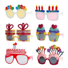 birthday cupcakes, sunglasses and cake decorations are shown in this set - up