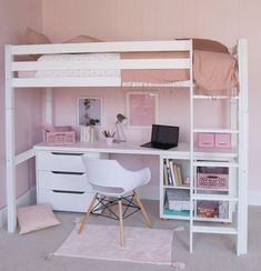 a white loft bed sitting next to a desk