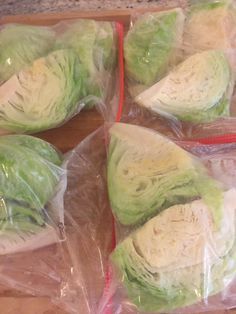 four pieces of lettuce wrapped in plastic