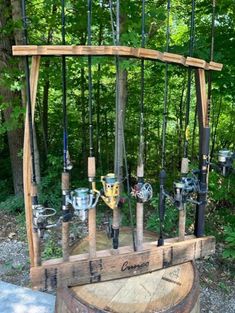 an old wooden barrel with fishing rods hanging from it