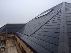 there are many different types of roofs on this building, including one that has a solar panel attached to the roof