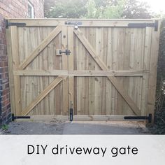 a wooden gate with the words diy driveway gate