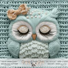 an owl is sitting on top of a knitted blanket with pearls and beads around it's eyes