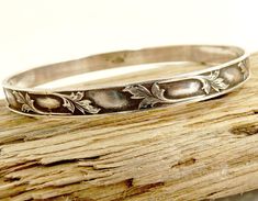 Vintage Art Nouveau Sterling Bangle Bracelet Lily Pattern Art Nouveau Inspired, Vintage Sterling Silver Bangle Bracelet Adoring, Lily Flower Leaf Pattern 1/4" Wide  7 3/4" Circumference  Marked Sterling On The Interior  jujubee1.etsy.com To Browse My Shop Lily Pattern, Silver Bangle Bracelet, Sterling Silver Bangle Bracelets, Sterling Silver Bangle, Flower Leaf, All That Jazz, Sterling Silver Bangles, Silver Bangle, Lily Flower