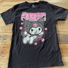 New! Sanrio/Hello Kitty Kuromi T Shirt. Black. Size: Small Kawaii Black Top For Streetwear, Black Kawaii Top For Streetwear, Kawaii Pink Top With Screen Print, Pink Kawaii Top With Screen Print, Kawaii Black Top With Character Print, Kawaii Black T-shirt With Letter Print, Kawaii Black T-shirt With Screen Print, Black Kawaii Top With Character Print, Black Cotton Kawaii Top