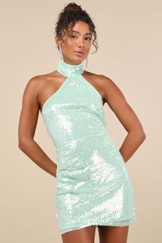 If you have iconic intentions, then the Lulus Sensational Purpose Mint Sequin Halter Tulip Mini Dress is the perfect look to achieve them! A multitude of dazzling clear sequins dance across this stunning dress that features a sleeveless darted bodice and a high, halter neckline (with two button-loop closures at back). The fitted waist tops a tulip-style skirt that boasts an overlapping panel that gathers at the side and finishes at a flirty mini hem. Hidden back zipper/clasp. Fit: This garment f Green Sequin Dress, Sequin Halter Dress, Sequin Halter, Trip Outfits, Sparkly Dress, Dresses Backless, Style Skirt, Halter Neckline, Stunning Dresses