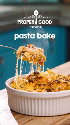 a casserole dish with pasta being lifted from it