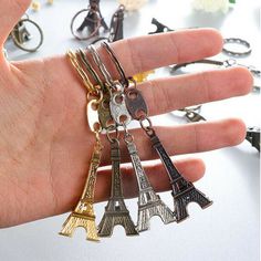 Description: Product Name:Eiffel Tower Key Chain Product Size:9.5x2cm Product Material:Metal Alloy   Color:Bronze,Gold,Silver,Copper    Package Include: 4pcs Random Color Key Rings. Appearance:It's Eiffel Tower which is Romantic and fashion,a good present for family and lover.   Package Includ:4pcs Keychain       On Jun 19, 2022 at 22:49:27 PDT, seller added the following information: Eiffel Tower Keychain, French Souvenirs, Paris Tower, Motorcycle Keychain, Paris Tour Eiffel, Color Key, Keychain Fob, Keychain Bag, Paris Eiffel Tower