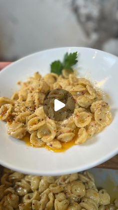 a white plate topped with macaroni and cheese