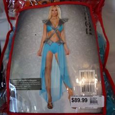 the package is wrapped in plastic and has a woman's costume on it, as well as other items