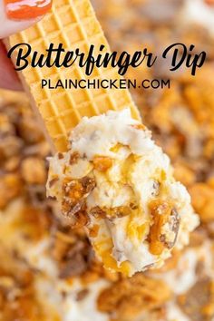 a scoop of butterfingered dip is being held up with a waffle cone