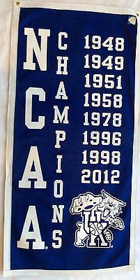 a blue and white banner with the words north carolina on it, hanging from a wall