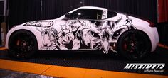 a white sports car with black and white designs on it