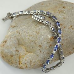 Aaa Tanzanite And Moissanite. Bracelet. (8) In. Platinum Over Sterling Silver Aaa Tanzanite Ovals. (26) Ct.(53) Mm. Moissanite Rounds. (26) Ct.(2) Mm. (8) Ctw.Prong Set. Tab Insert. Aaa Tantalizing Tanzanite Color's. Blue Purplish Blue. Blueberry Violet Blue Adjacent Next To Electrifying Scintillating Glistening Moissanite. Beautiful Gorgeous. New. Gift Box Included. Elegant Silver Gemstones With Brilliant Cut, Moissanite Bracelet, Color Purple, Platinum, Violet, Gift Box, Women Jewelry, Gift Ideas, Bracelet