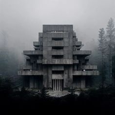 an unusual building in the middle of a forest on a foggy day with trees around it