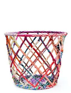 a colorful basket sitting on top of a white table