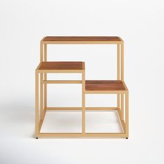 two wooden tables sitting side by side against a white background with no one in the photo