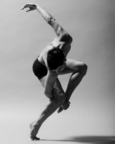 a man is doing a handstand in the air