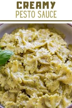 creamy pesto sauce in a white bowl with basil leaves on top and text overlay