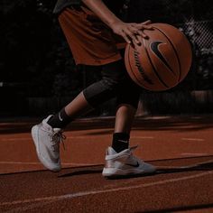 a person holding a basketball on a court