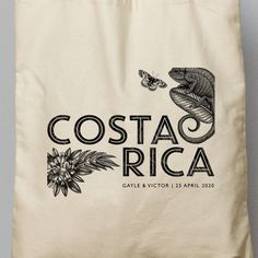 a tote bag with the costa rica logo on it and a butterfly in flight