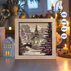 a wooden frame with a christmas scene cut out on it and lit candles in the background