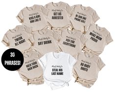 a group of t - shirts with words on them