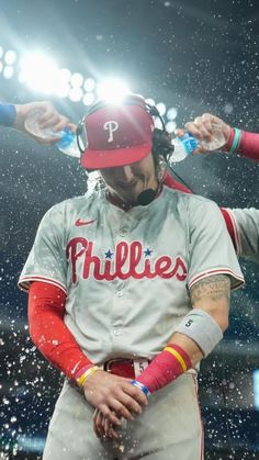 MLB baseball wallpaper background of Philadelphia Phillies star Bryson Stott getting showered with water by teammates at a post game interview following a win Bryson Stott Wallpaper, Phillies Baseball Party, Philadelphia Eagles Wallpaper, Eagles Wallpaper