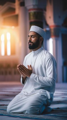 a man sitting in the middle of a room praying