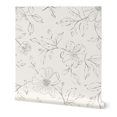 a white wallpaper with black and white floral designs on it, against a white background