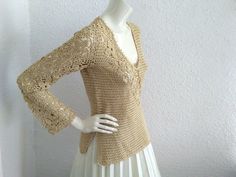 70s crochet blouse, fishnet shiny top, bell sleeve, handknitted evening blouse, V-neck, floral embroidery, glitter lurex blouse, see through blous, golden color. very good vintage condition but the item is not dry clean. Measurements laying flat : shoulders :36 cm (14 inches) bust :40cm (15.5 inches) waist :38 cm (15 inches) total lenght :61 cm (24 inches) sleeve lenght :60 cm (23,5 inches) Blouse Au Crochet, 70s Crochet, Evening Blouses, Retro Tops, Blouse Price, Crochet Blouse, Floral Embroidery, Romania, Womens Clothing Tops