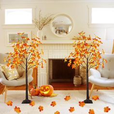 the living room is decorated with fall leaves