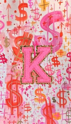 the letter k is painted with pink and red paint on white paper, surrounded by various symbols