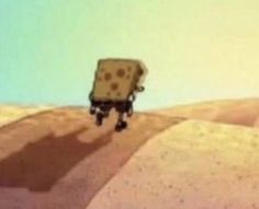 an animated image of a person walking across a desert area with a piece of cheese on his back