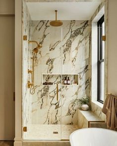 a bath room with a tub and a shower