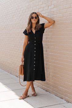 This Black Button Down Midi Dress is a sophisticated and versatile piece perfect for a variety of occasions! Made from a blend of linen and rayon, this dress combines breathability with a smooth, soft texture, ensuring comfort and style. Features a notched collar, a button down front, and a tie belt that cinches at the waist, accentuating your figure and adding a customizable fit. Style it with flat sandals and a wide-brimmed hat for a comfortable yet stylish weekend look! Casual Everyday Dresses, Button Down Midi Dress, Brimmed Hat, Work Dresses, Button Down Dress, Wide Brimmed Hats, Everyday Dresses, Notched Collar, Dressy Casual