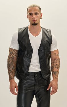 Crafted from premium leather, this vest boasts durability and a luxurious feel. The leather is typically sourced from high-quality hides, ensuring a supple texture and robust performance. The stitching is often reinforced for longevity, emphasizing both style and functionality. Ideal for both casual and semi-formal occasions, the leather vest can be dressed up with a crisp shirt and trousers or dressed down with a T-shirt and jeans. Its timeless appeal makes it suitable for various seasons, offering warmth during cooler months while remaining breathable. SIZE + FITTailored fit, to find your correct size use the ''what's my size '' button. COMPOSITION 100% Lambskin LeatherMade in TurkeyStyle #: 51094CARESpecialist Leather Clean Only Black Luxury Vest, Black Luxury Sleeveless Vest, Luxury Black Sleeveless Vest, Masculine Fitted Black Leather Jacket, Sleeveless Black Leather Jacket For Fall, Black Leather Vest For Fall, Luxury Black Vest For Fall, Sleeveless Leather Outerwear For Biker Events, Classic Sleeveless Leather Vest