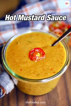 hot mustard sauce in a glass jar with a red pepper on the top and text overlay that reads, hot mustard sauce