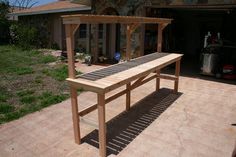 a wooden bench sitting in the middle of a yard