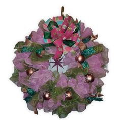 a wreath with purple and green decorations on it