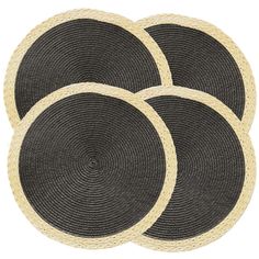 three black and white round placemats on a white background, set of four