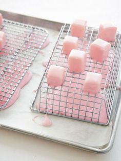 some pink marshmallows on a metal tray