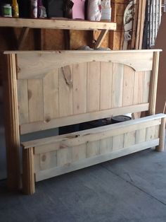 a wooden bench sitting in front of a wall