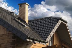 the roof of a house with a sky background