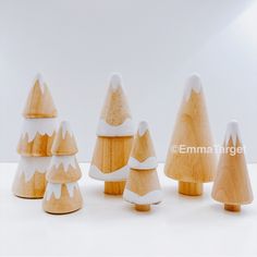 small wooden trees with white snow on them