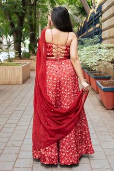 Red attached cancan lehenga with all over floral print. Paired with a padded blouse with placed hand embroidery and dupatta with mirror work hand embroidery. - Aza Fashions Red Art Silk Palazzo Set With Sheer Dupatta, Red Palazzo Set With Unstitched Blouse For Navratri, Red Sleeveless Lehenga For Weddings, Sleeveless Red Lehenga For Wedding, Red Palazzo Set With Unstitched Blouse For Diwali, Red Art Silk Floor-length Sharara, Red Lehenga For Wedding, Red Art Silk Dress With Cutdana, Red Cutdana Art Silk Dresses