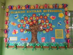 the bulletin board is decorated with colorful flowers and leaves, including an image of a tree