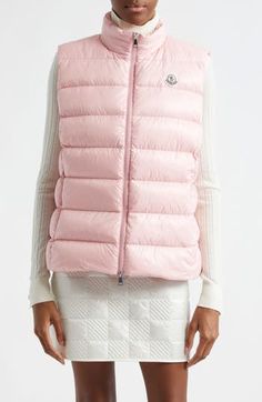 Signature channel-quilting brings Moncler flair to a stand-collar vest crafted of lacquered nylon and insulated with lofty down fill. Two-way front-zip closure Stand collar On-seam zip pockets Lined, with down fill 100% polyamide Dry clean Imported Women's Designer Clothing